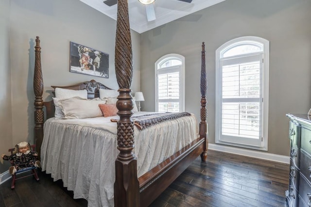 bedroom featuring crown molding, dark wood-type flooring, and ceiling fan