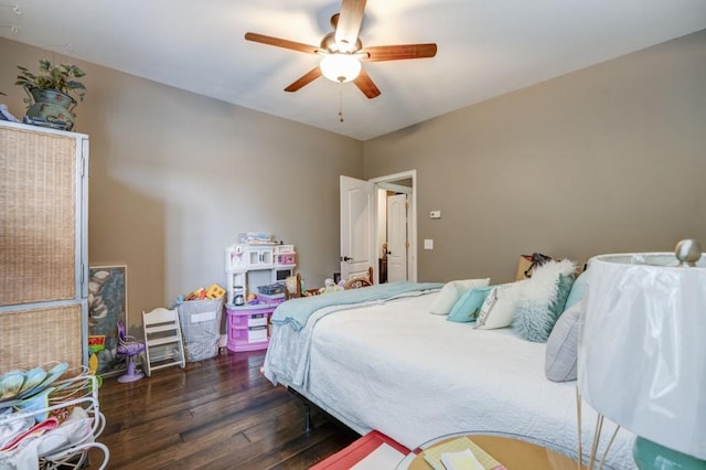 bedroom with dark wood-type flooring and ceiling fan