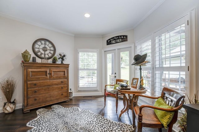 sitting room with dark hardwood / wood-style flooring and ornamental molding