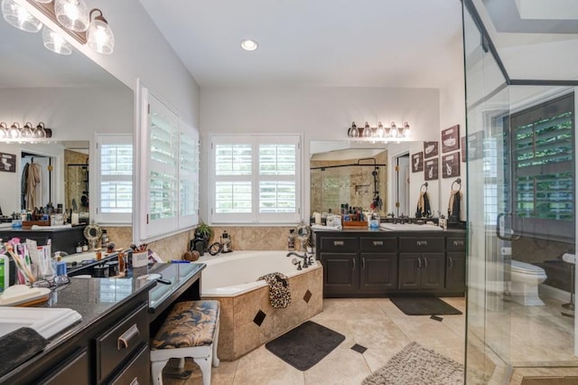 full bathroom with vanity, tile patterned floors, plus walk in shower, and toilet