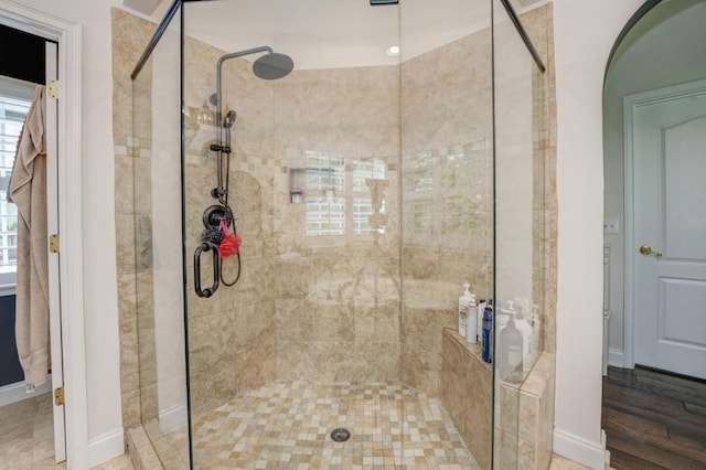 bathroom with a shower with shower door