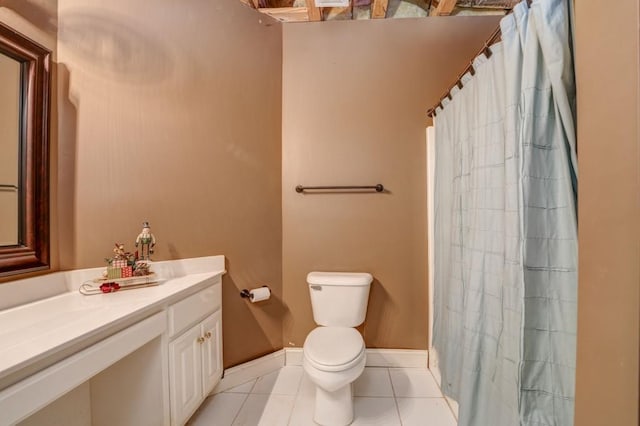 bathroom with vanity, tile patterned floors, and toilet