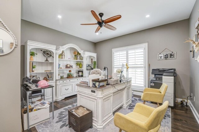 office space featuring dark hardwood / wood-style floors and ceiling fan