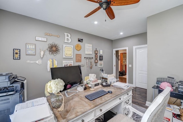 office featuring dark wood-type flooring and ceiling fan