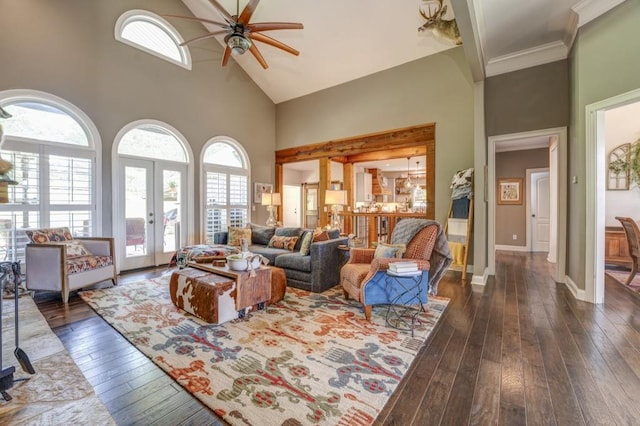 living room featuring crown molding, ceiling fan, high vaulted ceiling, dark hardwood / wood-style flooring, and french doors