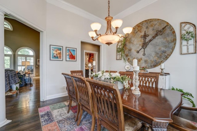 dining space featuring ornamental molding, dark wood-type flooring, and an inviting chandelier