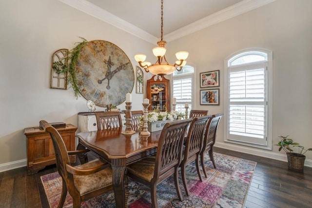 dining area with a notable chandelier, crown molding, and dark wood-type flooring