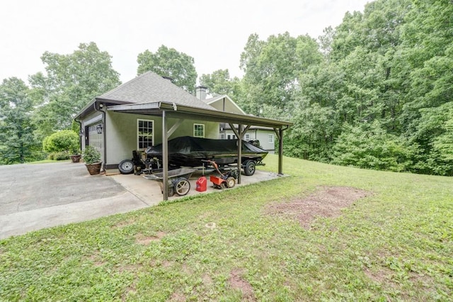 exterior space with a garage and a lawn