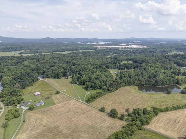 aerial view with a water and mountain view and a rural view