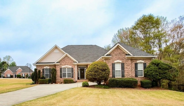 118 Jasmine Way, Carrollton, GA 30180 - view of front of house featuring brick siding, a front lawn, and roof with shingles