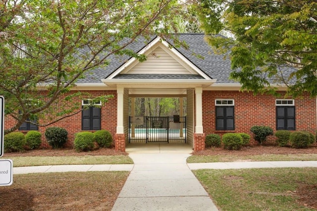 view of property's community with a yard and concrete driveway
