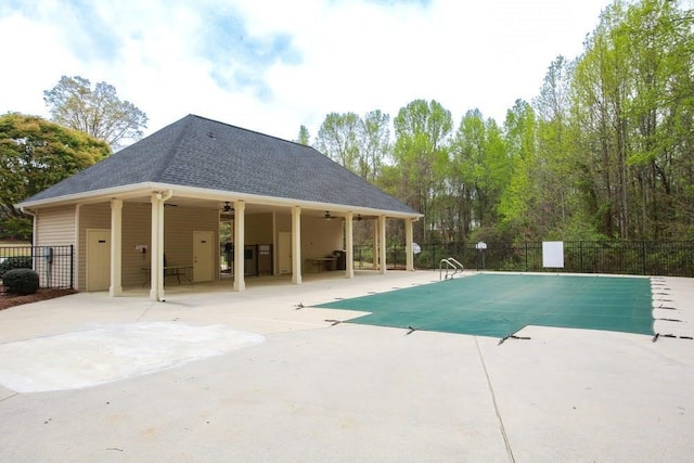 view of pool with a ceiling fan, fence, and a patio area