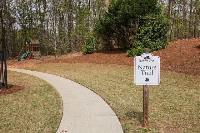surrounding community featuring a lawn