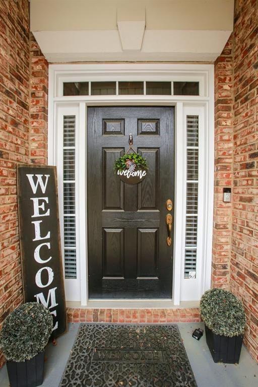 entrance to property with brick siding