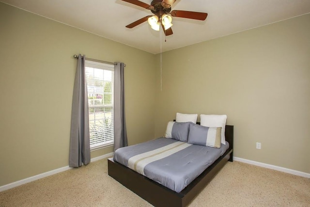 bedroom with baseboards, light colored carpet, and a ceiling fan