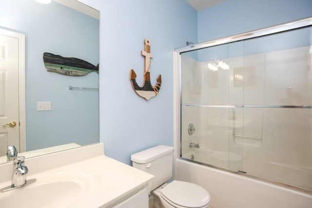 full bathroom featuring vanity, enclosed tub / shower combo, and toilet