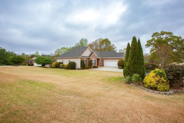 118 Jasmine Way, Carrollton, GA 30180 - view of front facade with an attached garage, a front yard, and driveway