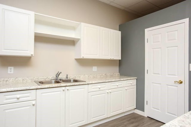 118 Jasmine Way, Carrollton, GA 30180 - kitchen with a sink, white cabinetry, wood finished floors, and open shelves