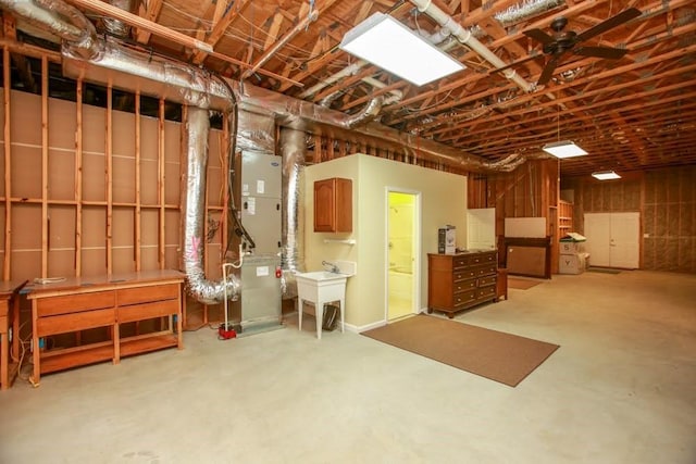unfinished below grade area featuring heating unit