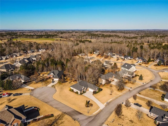 aerial view of property and surrounding area with nearby suburban area