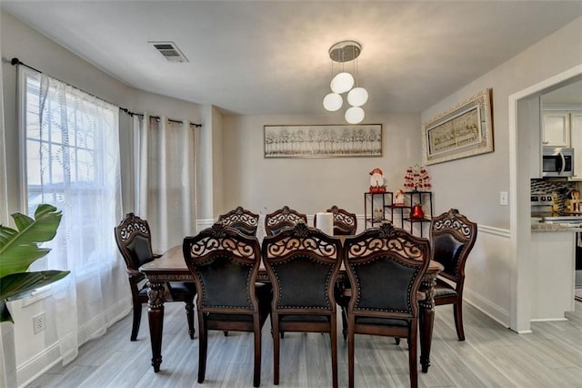 dining area featuring light hardwood / wood-style floors