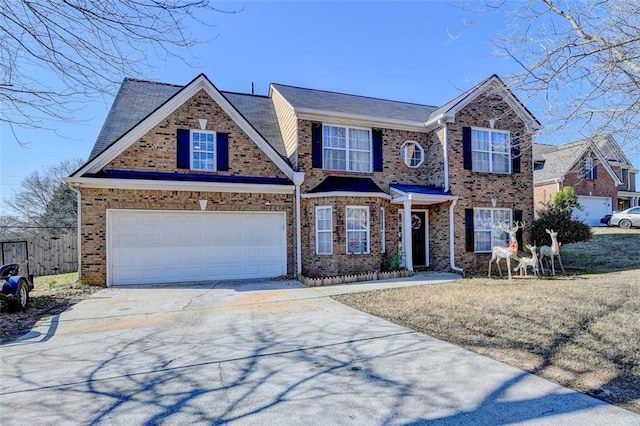 view of front facade featuring a front yard and a garage