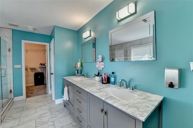 bathroom with vanity and walk in shower