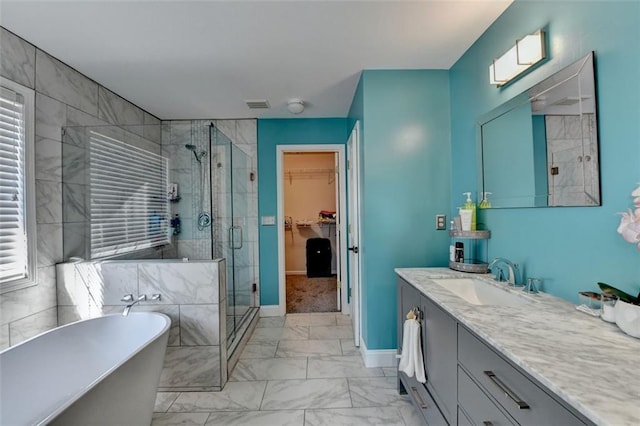 bathroom with vanity and plus walk in shower