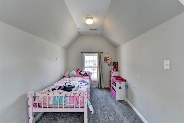 carpeted bedroom with vaulted ceiling