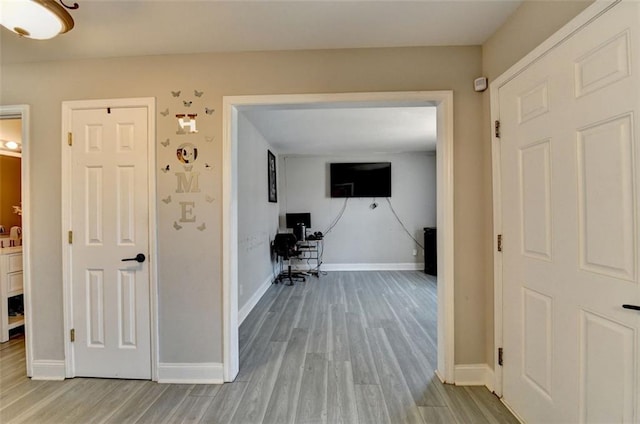 corridor featuring light hardwood / wood-style flooring