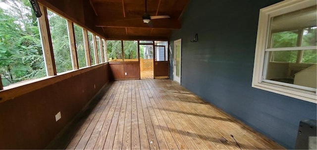 unfurnished sunroom featuring wooden ceiling, lofted ceiling, and ceiling fan