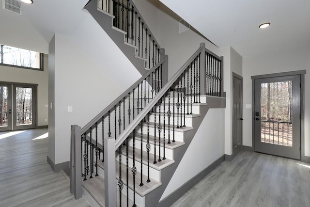 221 Dragonfly Cv, Toccoa, GA 30577 - foyer featuring wood finished floors, healthy amount of natural light, stairway, recessed lighting, and a towering ceiling