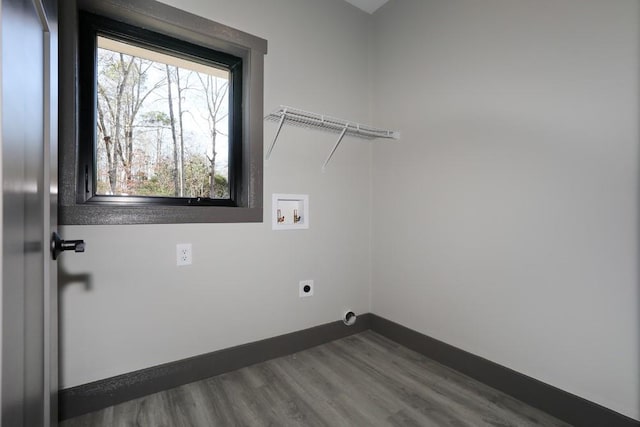 laundry room with hookup for a washing machine, dark wood-type flooring, and hookup for an electric dryer