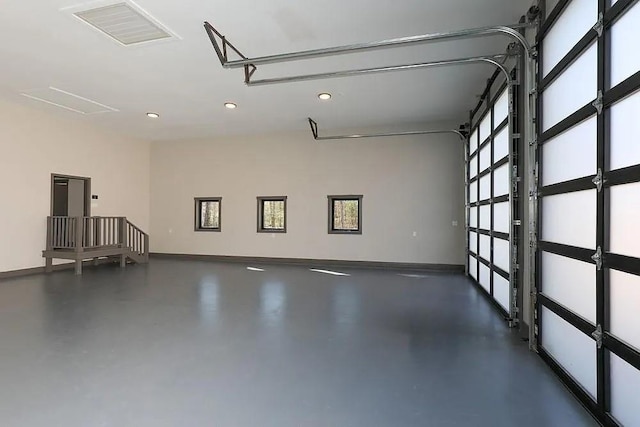 garage with baseboards and visible vents