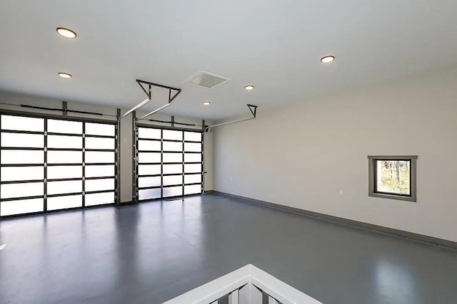 garage featuring recessed lighting, visible vents, and baseboards