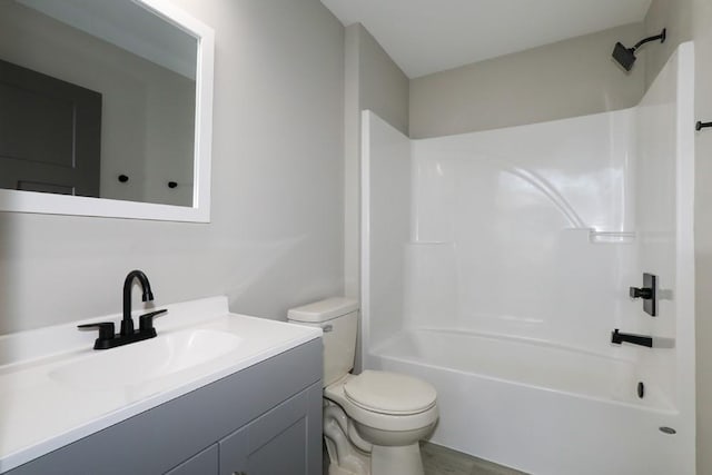 full bath with toilet, shower / tub combination, and vanity