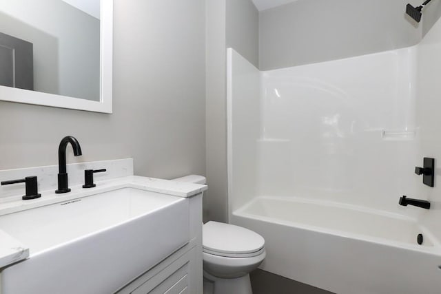 full bathroom featuring shower / bathing tub combination, vanity, and toilet