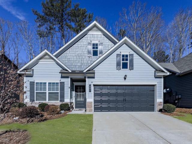 craftsman inspired home with a garage and a front yard