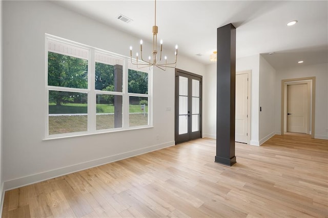 554 Mcdaniel Station Rd SW, Calhoun, GA 30701 - unfurnished dining area with healthy amount of natural light, french doors, a chandelier, and recessed lighting