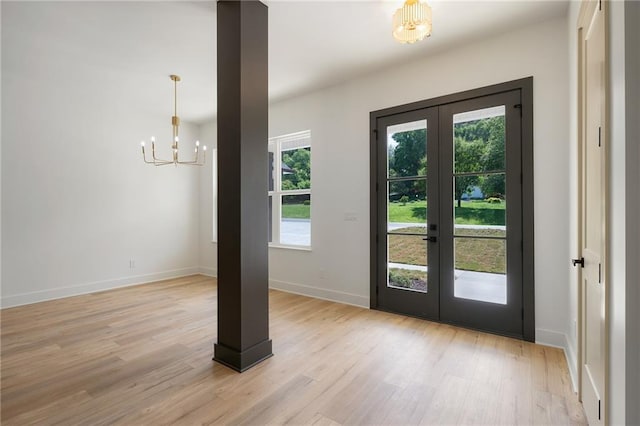 554 Mcdaniel Station Rd SW, Calhoun, GA 30701 - doorway to outside featuring french doors, a chandelier, light wood finished floors, and baseboards