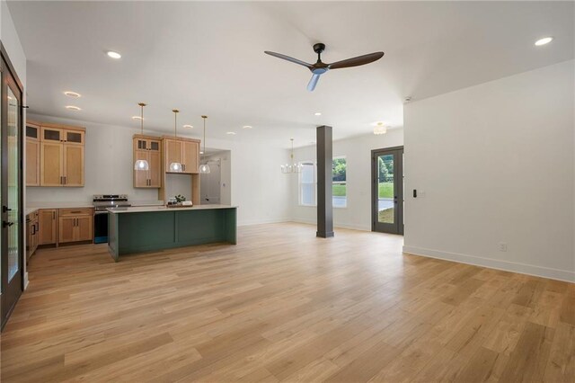 554 Mcdaniel Station Rd SW, Calhoun, GA 30701 - unfurnished living room featuring light wood-type flooring, ceiling fan, recessed lighting, baseboards, and a chandelier