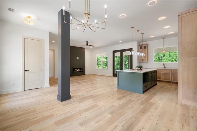 554 Mcdaniel Station Rd SW, Calhoun, GA 30701 - kitchen with a chandelier, a center island, light countertops, light wood-style flooring, and recessed lighting
