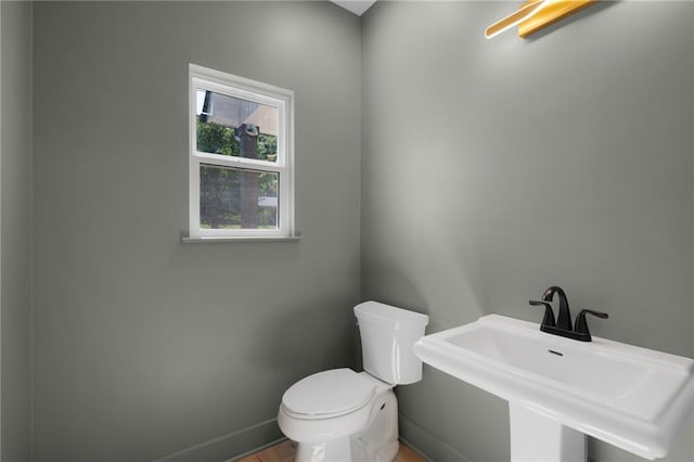 554 Mcdaniel Station Rd SW, Calhoun, GA 30701 - bathroom with toilet, a sink, and baseboards