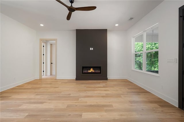 554 Mcdaniel Station Rd SW, Calhoun, GA 30701 - unfurnished living room with ceiling fan, baseboards, light wood finished floors, recessed lighting, and a fireplace