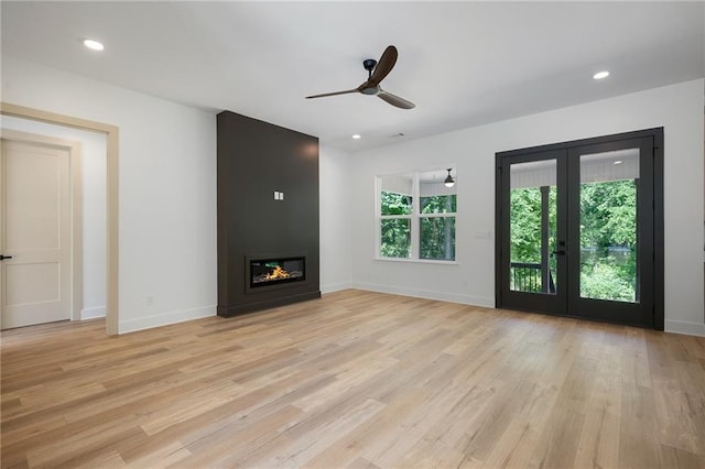 554 Mcdaniel Station Rd SW, Calhoun, GA 30701 - unfurnished living room featuring light wood-style floors, baseboards, ceiling fan, and recessed lighting