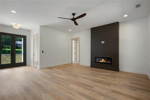 554 Mcdaniel Station Rd SW, Calhoun, GA 30701 - unfurnished living room featuring french doors, ceiling fan, light wood-style flooring, baseboards, and recessed lighting
