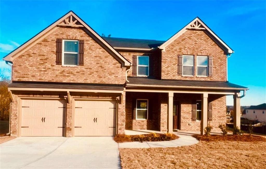 craftsman inspired home with a porch and a garage