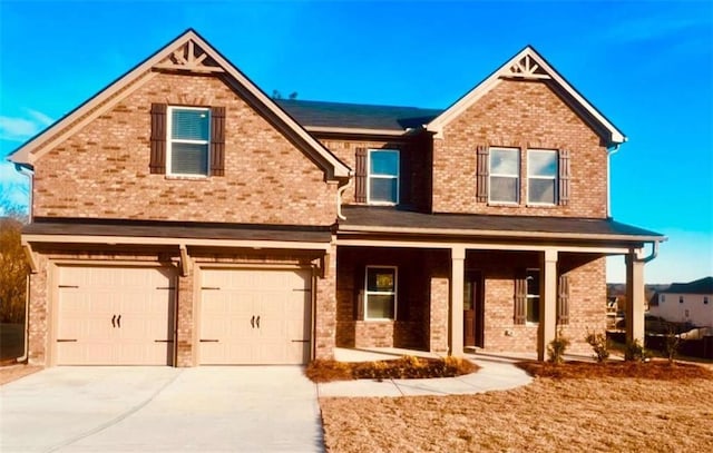 craftsman-style home featuring a garage and covered porch