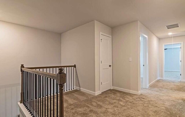 hallway with carpet