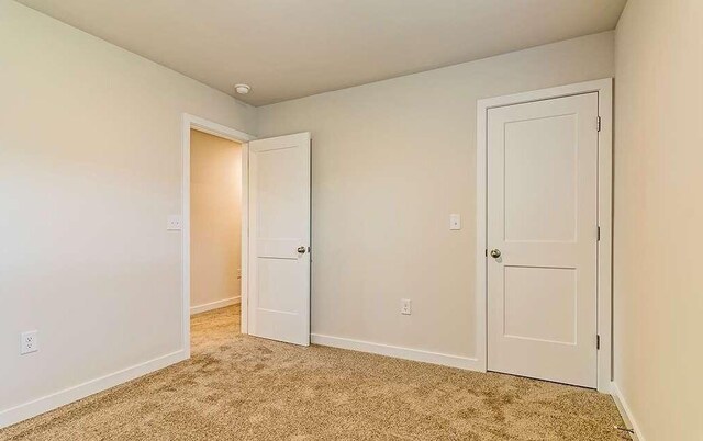 unfurnished bedroom with carpet